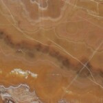 Orange nuvolato onyx slab and tiles for countertops